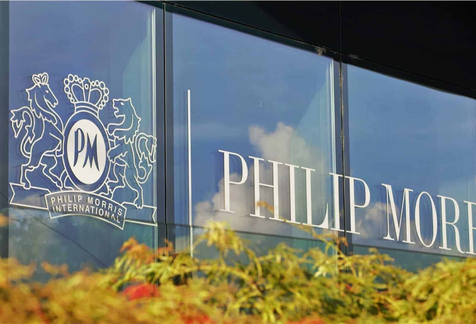 Phillip Morris International, PMI logo on glass window of building