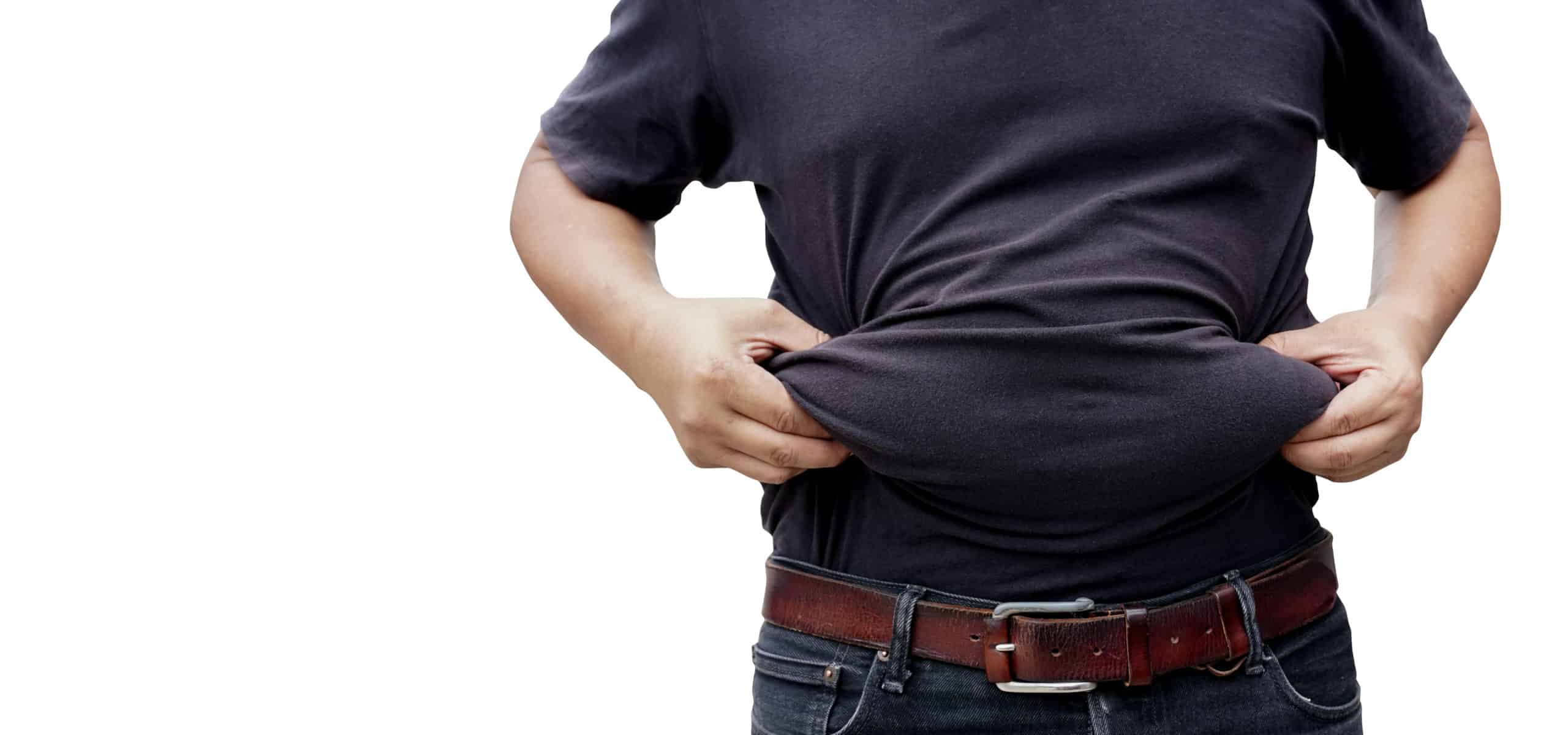 Overweight man in black t shirt grabbing belly fat