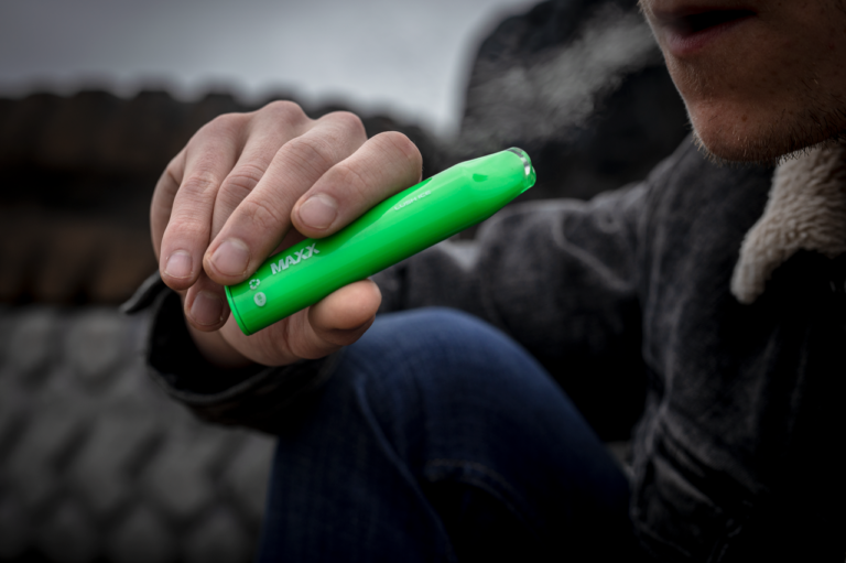 Cheap Ways To Vape: Hyppe Maxx Disposable Vape Green Being Vaped By A Man